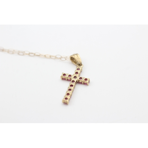 54 - 9ct gold ruby set cross pendant necklace (1.2g)