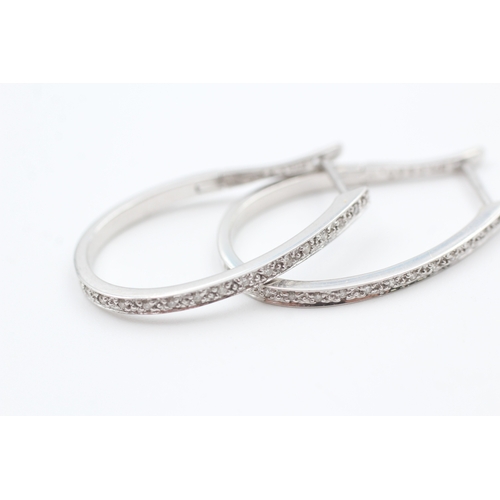 66 - 9ct white gold diamond full hoop earrings (3.3g)