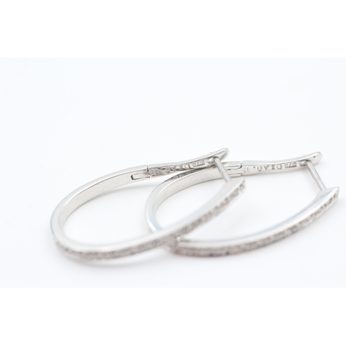 66 - 9ct white gold diamond full hoop earrings (3.3g)