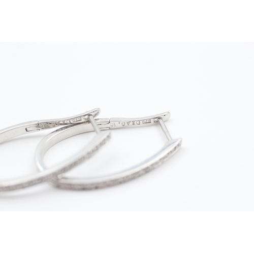 66 - 9ct white gold diamond full hoop earrings (3.3g)