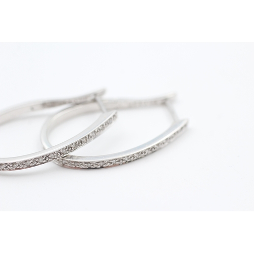 66 - 9ct white gold diamond full hoop earrings (3.3g)