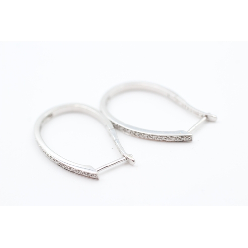 66 - 9ct white gold diamond full hoop earrings (3.3g)