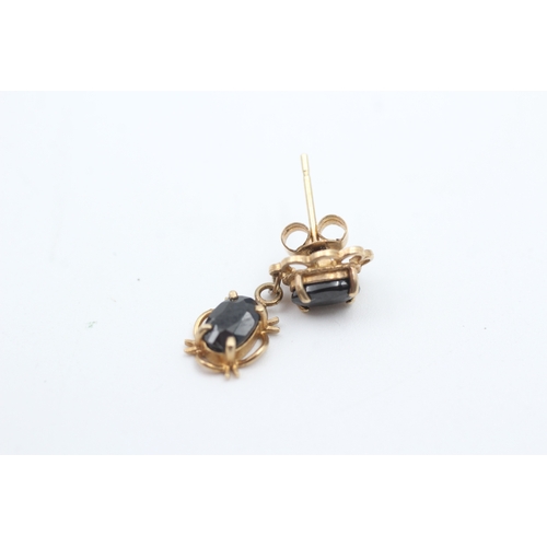 69 - 9ct gold oval cut sapphire set drop earrings (2.1g)