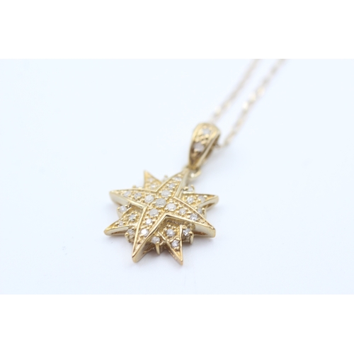 70 - 9ct gold diamond starburst pendant necklace (2.3g)