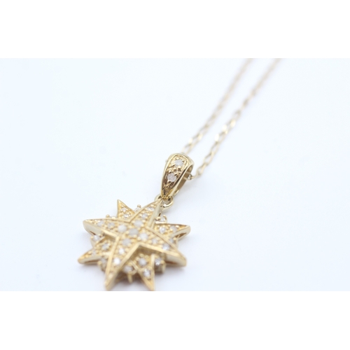 70 - 9ct gold diamond starburst pendant necklace (2.3g)