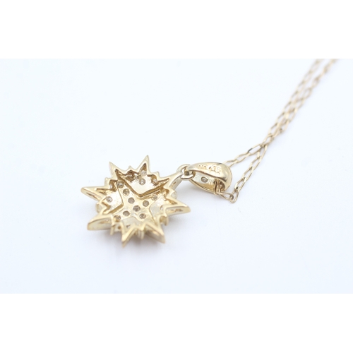 70 - 9ct gold diamond starburst pendant necklace (2.3g)