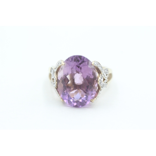 79 - 9ct gold diamond accented amethyst set cocktail ring (3g) Size  O