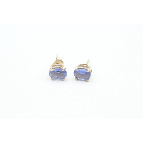 103 - 9ct gold oval cut sapphire set stud earrings (1g)