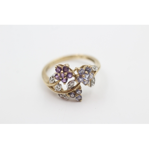 109 - 9ct gold tanzanite, diamond, and amethyst set floral garland ring (2.3g) Size  L