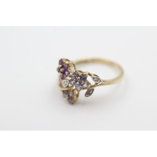 109 - 9ct gold tanzanite, diamond, and amethyst set floral garland ring (2.3g) Size  L