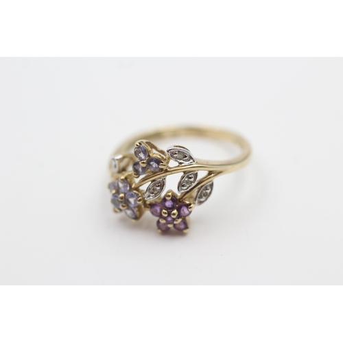 109 - 9ct gold tanzanite, diamond, and amethyst set floral garland ring (2.3g) Size  L