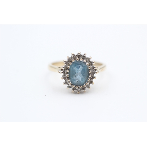 114 - 9ct gold diamond and blue topaz set cluster cocktail ring (3.1g) Size  M