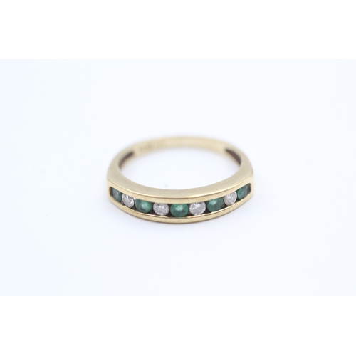 120 - 9ct gold channel set emerald and diamond set nine stone eternity ring (1.9g) Size  K