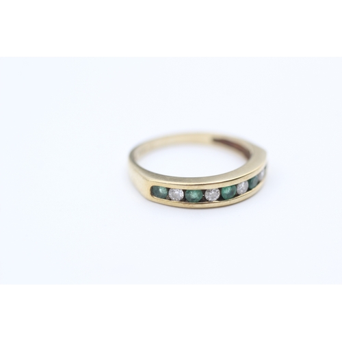 120 - 9ct gold channel set emerald and diamond set nine stone eternity ring (1.9g) Size  K