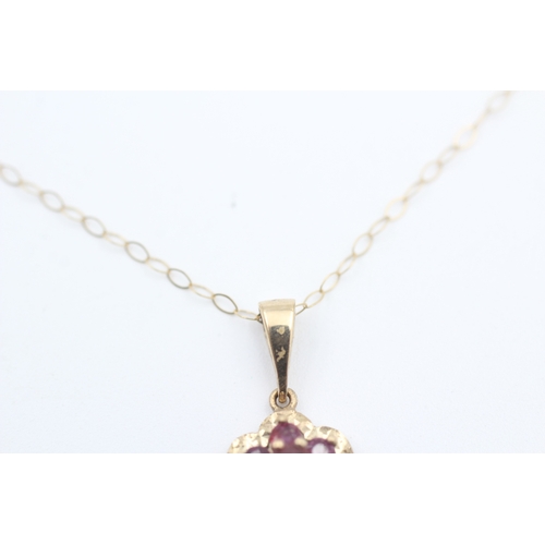 123 - 9ct gold ruby set cluster pendant necklace (1.8g)