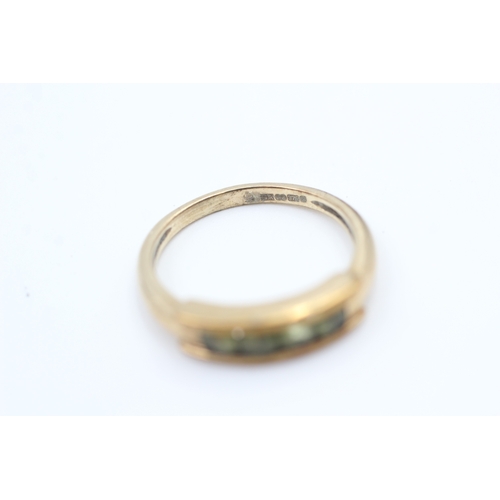 126 - 9ct gold channel set peridot four stone eternity ring (2.5g) Size  M