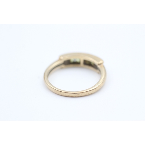 126 - 9ct gold channel set peridot four stone eternity ring (2.5g) Size  M