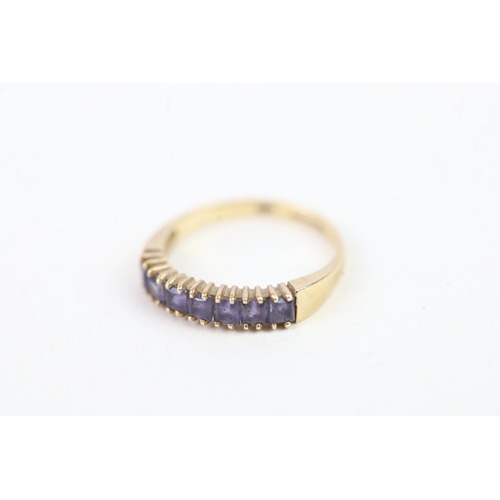 136 - 9ct gold square cut iolite set even stone eternity ring (1.4g) Size  K 1/2