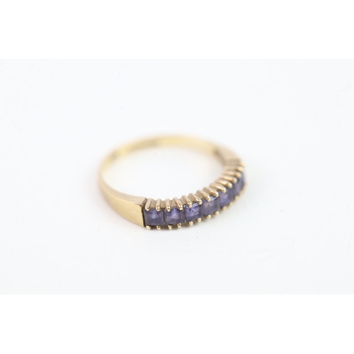 136 - 9ct gold square cut iolite set even stone eternity ring (1.4g) Size  K 1/2