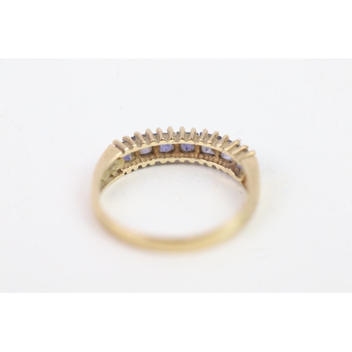 136 - 9ct gold square cut iolite set even stone eternity ring (1.4g) Size  K 1/2