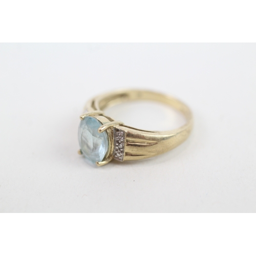 140 - 9ct gold diamond accented blue topaz set cocktail ring (3.2g) Size  M