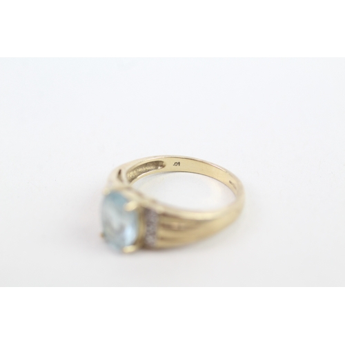 140 - 9ct gold diamond accented blue topaz set cocktail ring (3.2g) Size  M