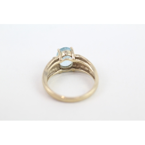 140 - 9ct gold diamond accented blue topaz set cocktail ring (3.2g) Size  M