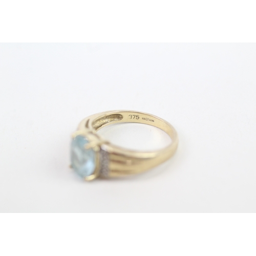 140 - 9ct gold diamond accented blue topaz set cocktail ring (3.2g) Size  M