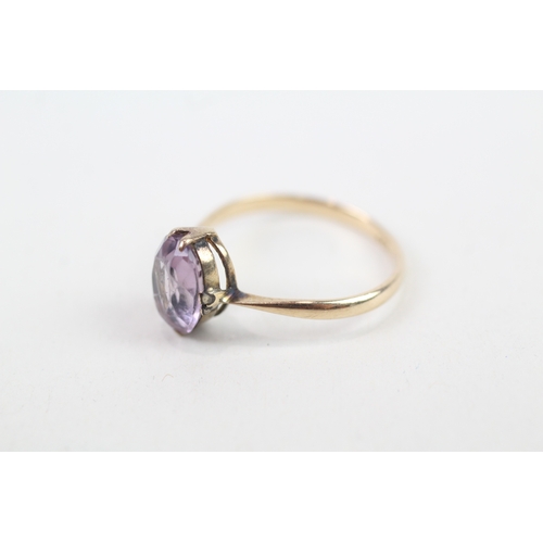 142 - 9ct gold vintage claw set oval cut amethyst solitaire ring (1.4g) Size  M