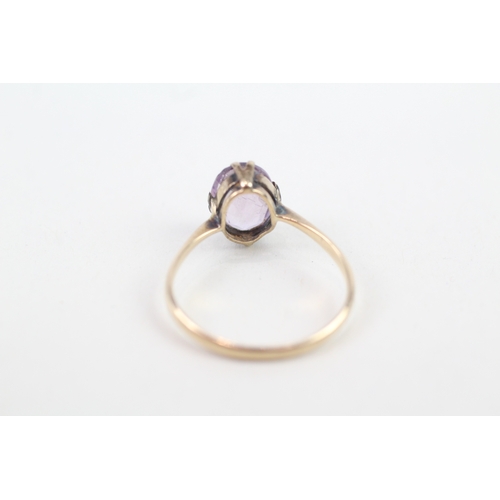 142 - 9ct gold vintage claw set oval cut amethyst solitaire ring (1.4g) Size  M