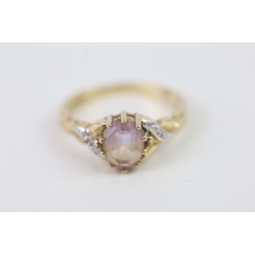 144 - 9ct gold diamond accented amethyst set dress ring (2.2g) Size  O