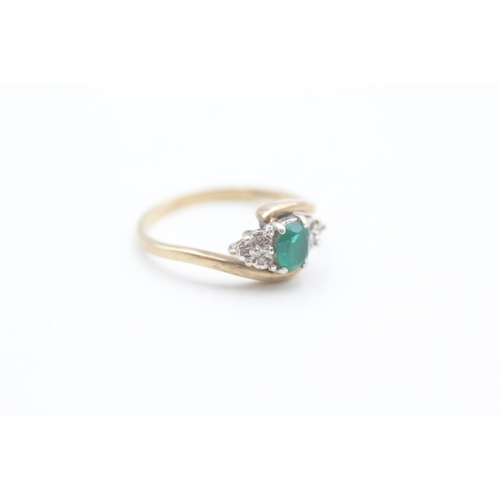 151 - 9ct gold diamond and green gemstone set dress ring (1.9g) Size  M