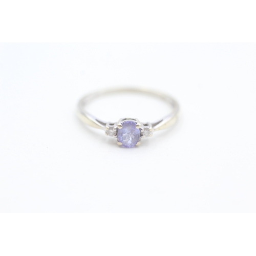 153 - 9ct gold diamond and tanzanite set dress ring (1.3g) Size  O