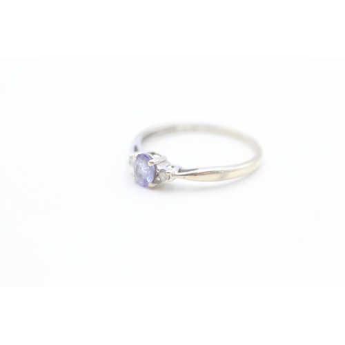 153 - 9ct gold diamond and tanzanite set dress ring (1.3g) Size  O