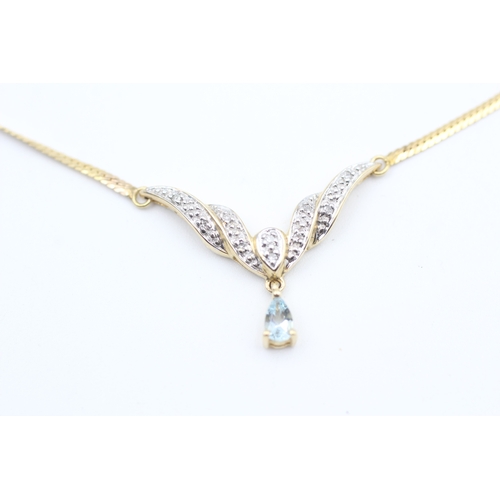 157 - 9ct gold diamond accented pear cut aquamarine static pendant necklace (4.1g)