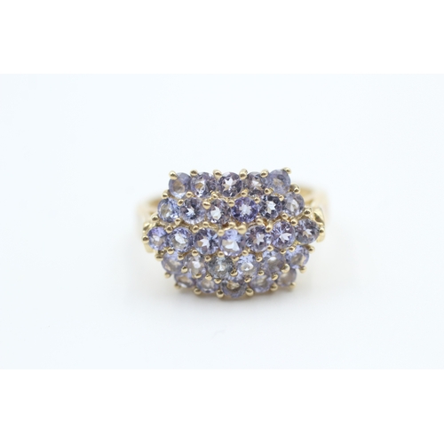 163 - 9ct gold tanzanite set cluster ring (5.2g) Size  Q