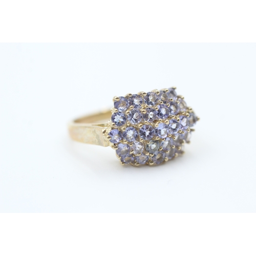 163 - 9ct gold tanzanite set cluster ring (5.2g) Size  Q