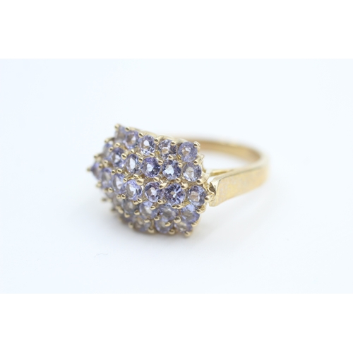 163 - 9ct gold tanzanite set cluster ring (5.2g) Size  Q