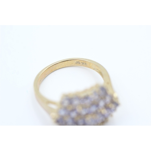 163 - 9ct gold tanzanite set cluster ring (5.2g) Size  Q