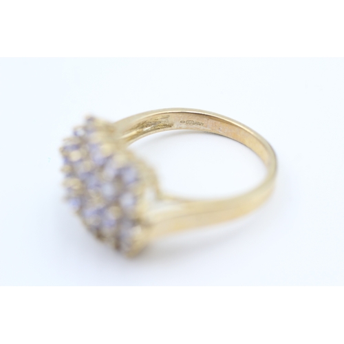 163 - 9ct gold tanzanite set cluster ring (5.2g) Size  Q