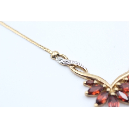 170 - 9ct gold diamond accented garnet set spray static pendant necklace (4.9g)