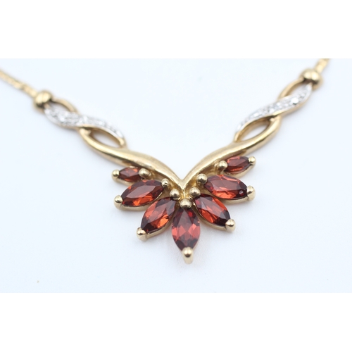 170 - 9ct gold diamond accented garnet set spray static pendant necklace (4.9g)