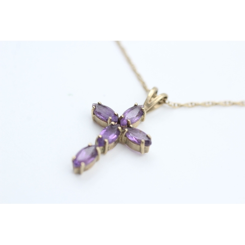 173 - 9ct gold oval cut amethyst set cross pendant necklace (1.8g)