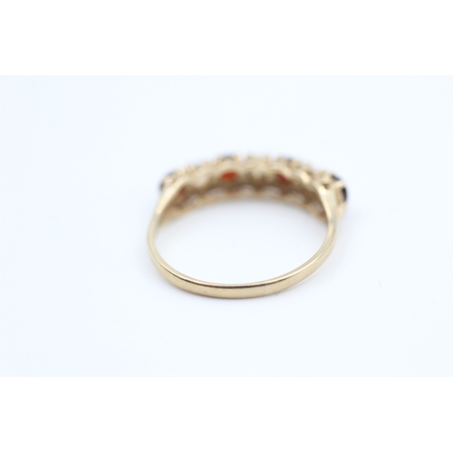 177 - 9ct gold opal and garnet set seven stone eternity ring (1.7g) Size  O