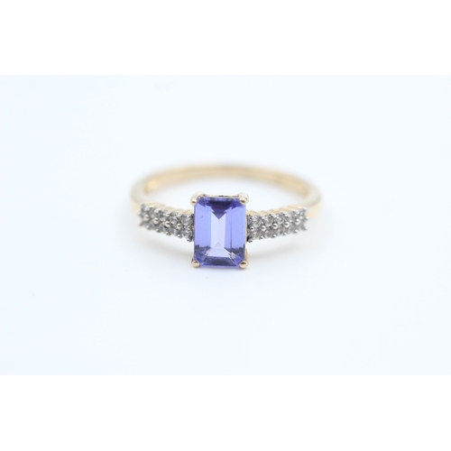 187 - 10kt gold tanzanite and white gemstone set dress ring (1.9g) Size  N