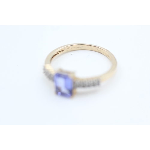 187 - 10kt gold tanzanite and white gemstone set dress ring (1.9g) Size  N