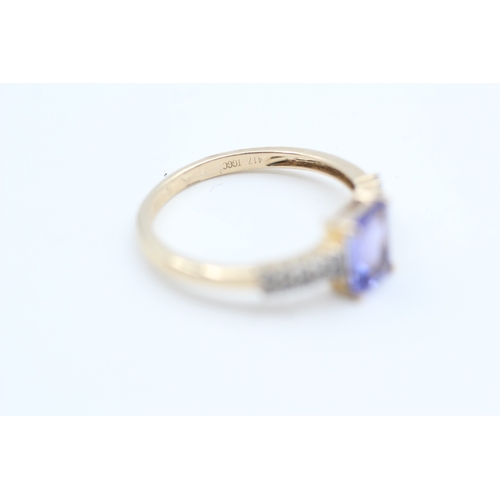 187 - 10kt gold tanzanite and white gemstone set dress ring (1.9g) Size  N