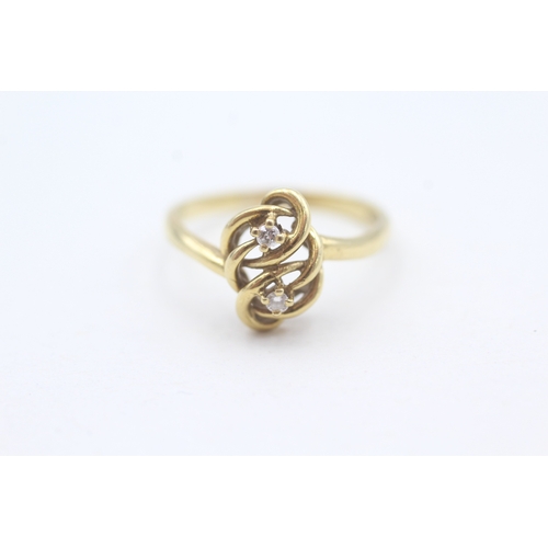 197 - 18ct gold diamond set eternal knot celtic style dress ring (3.5g) Size  P