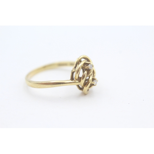 197 - 18ct gold diamond set eternal knot celtic style dress ring (3.5g) Size  P