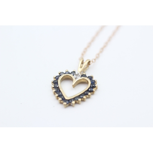 199 - 9ct gold sapphire set open heart pendant necklace (1.7g)